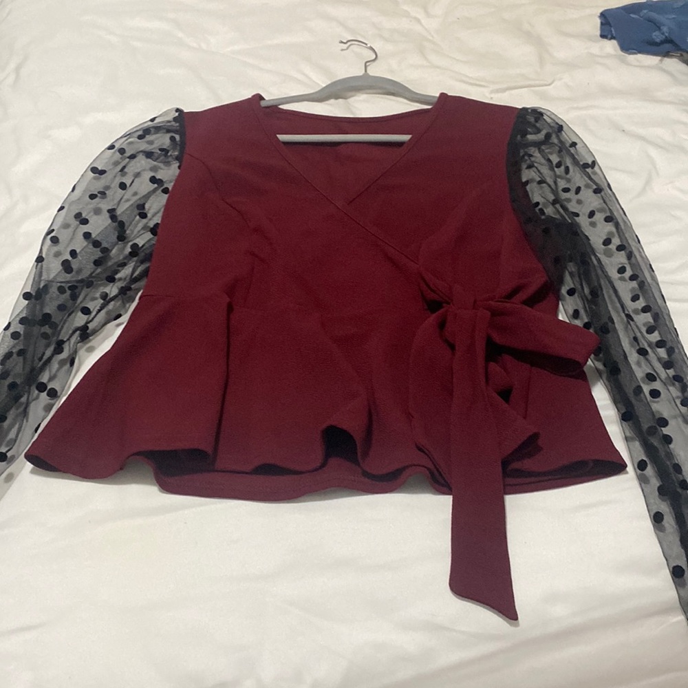 Long sleeve lace sleeves with polka dots. Has tie